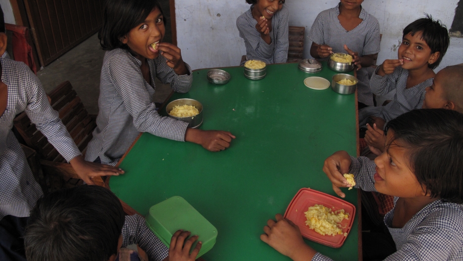 Girls eating their lunch in the school’s hallway. Girls eating their lunch in the school’s hallway.